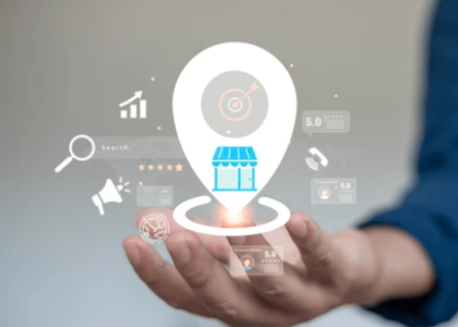 Hand presenting a digital location pin with business and SEO icons, symbolizing local search optimization for small businesses.