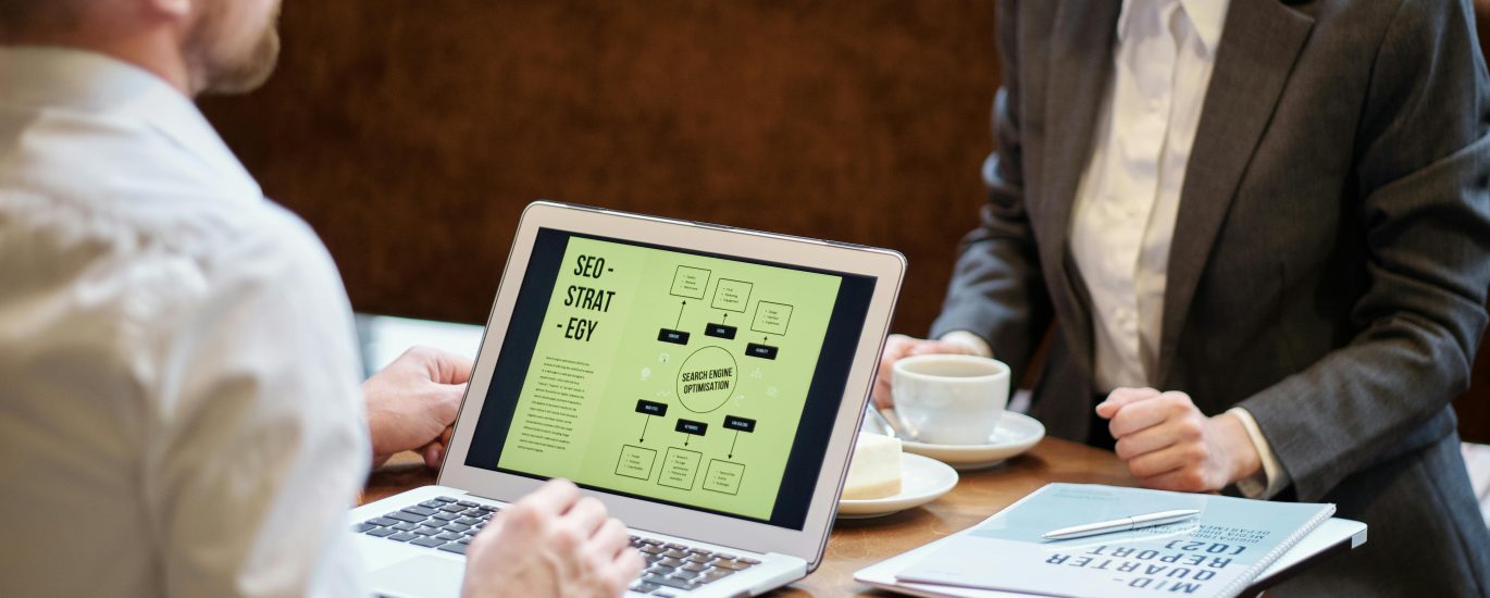 Business professionals discussing SEO strategy in a Boise coffee shop