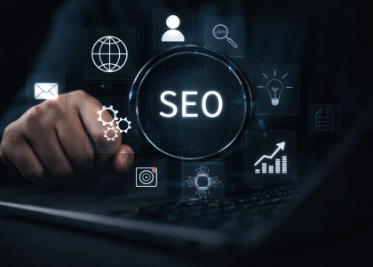 Person using a laptop with glowing SEO interface icons representing digital marketing strategy and search engine optimization for a Boise digital marketing company.