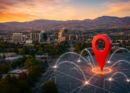 A futuristic Boise city skyline at sunset featuring a glowing digital location pin and connected network lines symbolizing local SEO growth, business visibility, and digital marketing infrastructure.